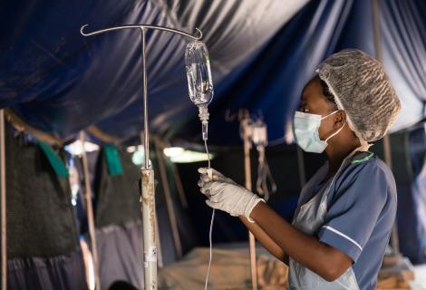 A nurse in Blantyre, Malawi attending to patients in a tent